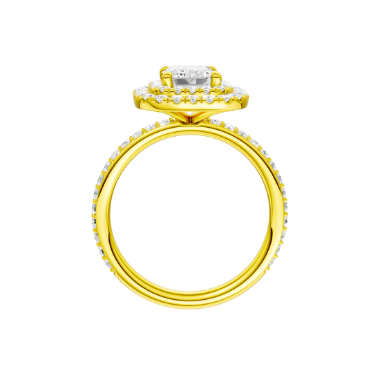 A profile view of the Emerald cut diamond engagement ring in 14k yellow gold with a prong diamond band and cathedral setting