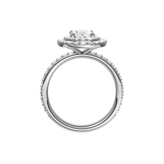 A profile view of the Oval cut diamond engagement ring in platinum with a prong diamond band and cathedral setting