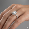 Radiant cut diamond engagement ring in 14k white gold with a prong diamond band and cathedral setting on a hand