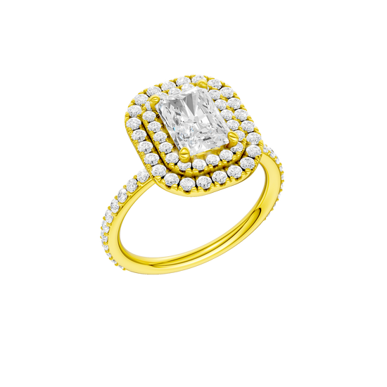 A three-quarter view of the Radiant cut diamond engagement ring in 14k yellow gold with a prong diamond band and cathedral setting