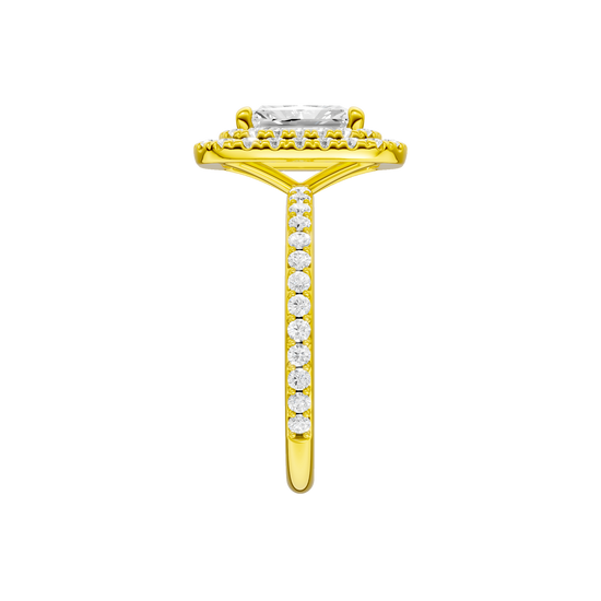 A side view of the Radiant cut diamond engagement ring in 14k yellow gold with a prong diamond band and cathedral setting
