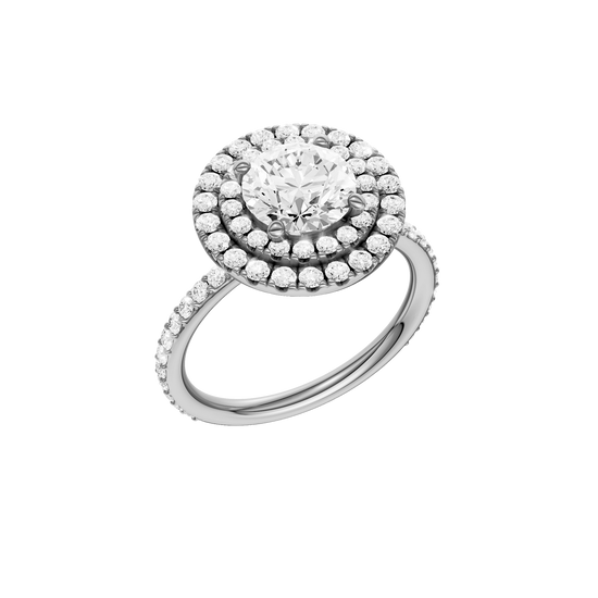 A three-quarter view of the Round cut diamond engagement ring in platinum with a prong diamond band and cathedral setting