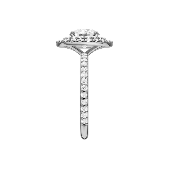 A side view of the Round cut diamond engagement ring in 14k white gold with a prong diamond band and cathedral setting