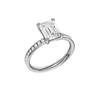 A three-quarter view of the Emerald cut diamond engagement ring in 14k white gold with a diamond channel band and cathedral setting