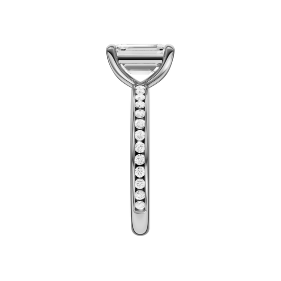 A side view of the Emerald cut diamond engagement ring in 14k white gold with a diamond channel band and cathedral setting