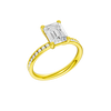 A three-quarter view of the Emerald cut diamond engagement ring in 14k yellow gold with a diamond channel band and cathedral setting