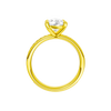 A profile view of the Pear cut diamond engagement ring in 14k yellow gold with a channel band and solitaire setting