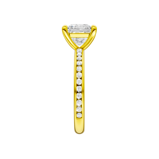 A side view of the Princess cut diamond engagement ring in 14k yellow gold with a diamond channel band and cathedral setting