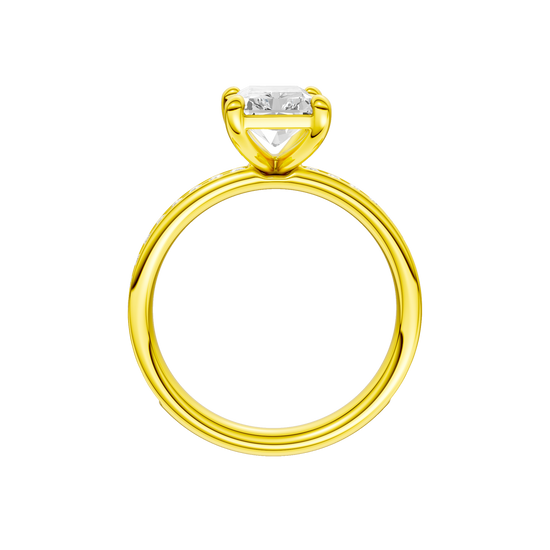 A profile view of the Radiant cut diamond engagement ring in 14k yellow gold with a diamond channel band and cathedral setting.