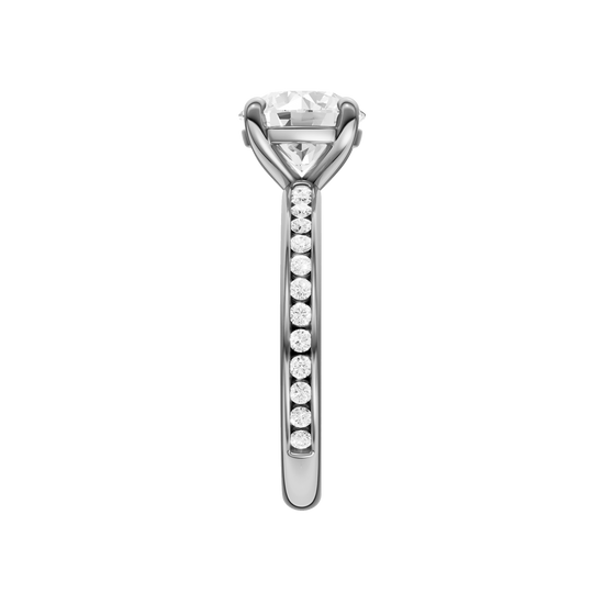 A side view of the Round cut diamond engagement ring in 14k white gold with a diamond channel band and cathedral setting