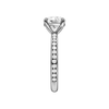 A side view of the Round cut diamond engagement ring in 14k white gold with a diamond channel band and cathedral setting