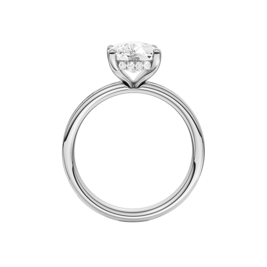 A profile view of the Elongated Cushion cut diamond engagement ring in platinum with a channel band and hidden halo setting