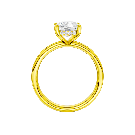 A profile view of the Elongated Cushion cut diamond engagement ring in 14k yellow gold with a channel band and hidden halo setting