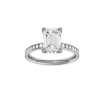 A front view of the Emerald cut diamond engagement ring in 14k white gold with a diamond channel band and cathedral setting