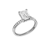 A three-quarter view of the Emerald cut diamond engagement ring in 14k white gold with a diamond channel band and cathedral setting