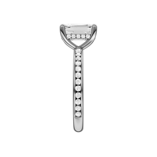 A side view of the Emerald cut diamond engagement ring in platinum with a diamond channel band and cathedral setting