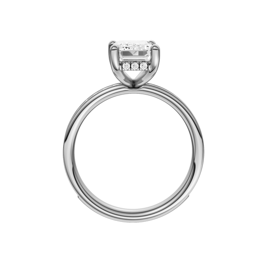 A profile view of the Emerald cut diamond engagement ring in platinum with a diamond channel band and cathedral setting