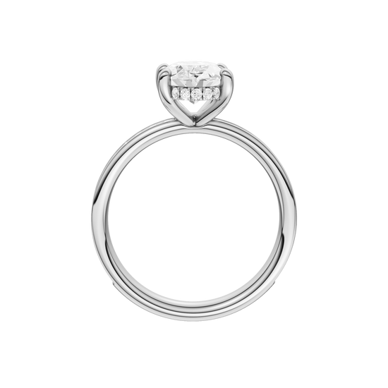 A profile view of the Oval cut diamond engagement ring in platinum with a diamond channel band and cathedral setting