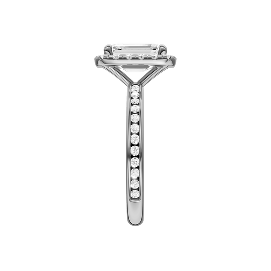 14K white gold emerald cut halo engagement ring side view detailing cathedral structure and diamond channel band.