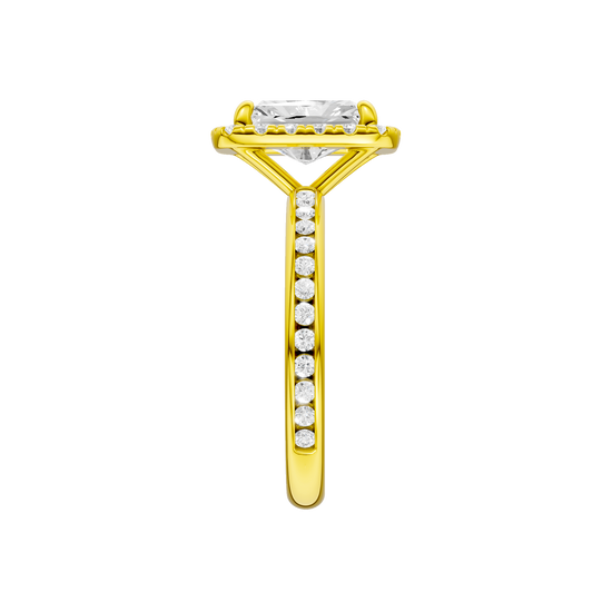 A side view of the Radiant cut diamond engagement ring in 14k yellow gold with a diamond channel band and cathedral setting