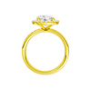 A profile view of the Round cut diamond engagement ring in 14k yellow gold with a diamond channel band and halo setting