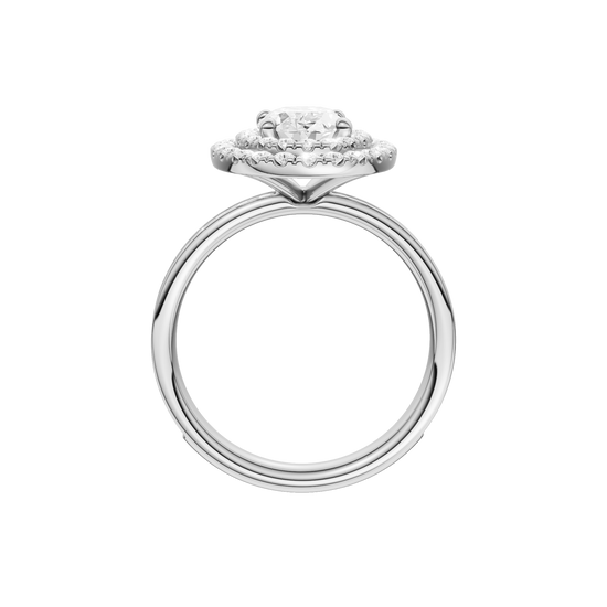 A profile view of the Oval cut diamond engagement ring in platinum with a diamond channel band and cathedral setting