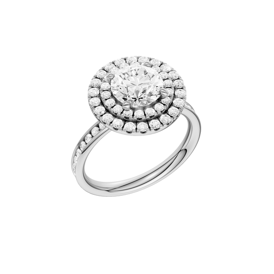 A three-quarter view of the Round cut diamond engagement ring in platinum with a diamond channel band and cathedral setting