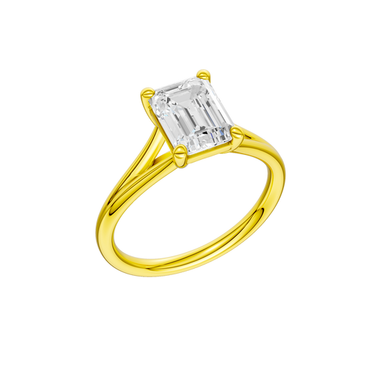 A three-quarter view of the Emerald cut diamond engagement ring in 14k yellow gold with a plain band and split setting