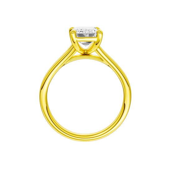 A profile view of the Emerald cut diamond engagement ring in 14k yellow gold with a plain band and split setting