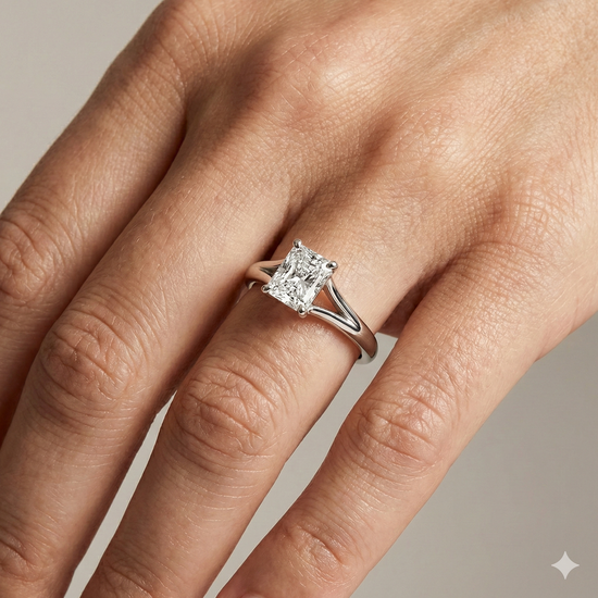 Radiant cut diamond engagement ring in 14k white gold with a plain band and split setting on a hand