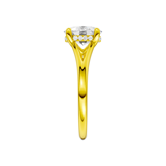 A side view of the Elongated Cushion cut diamond engagement ring in 14k yellow gold with a plain band and hidden halo setting