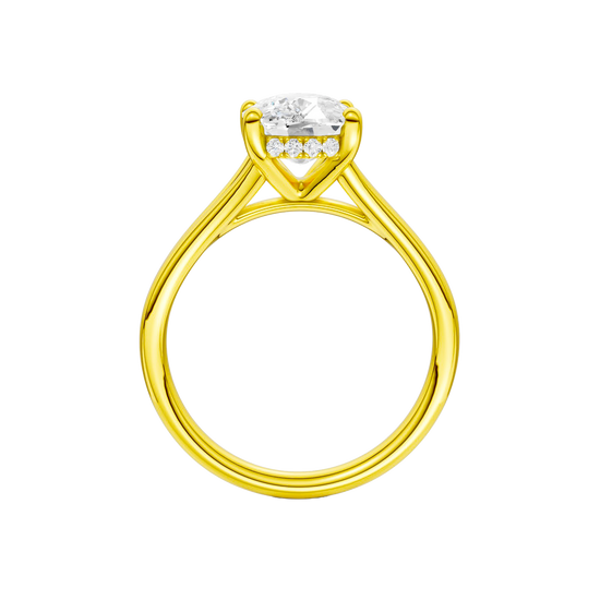 A profile view of the Elongated Cushion cut diamond engagement ring in 14k yellow gold with a plain band and hidden halo setting