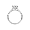 A profile view of the Marquise cut diamond engagement ring in platinum with a plain band and hidden halo setting