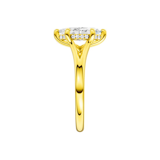 A side view of the Marquise cut diamond engagement ring in 14k yellow gold with a plain band and hidden halo setting