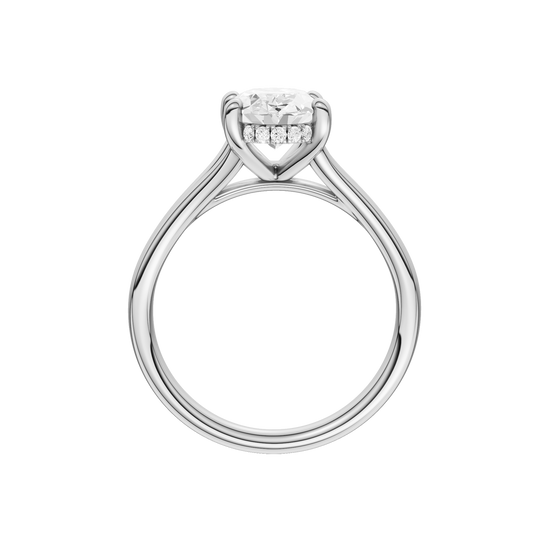 A profile view of the Oval cut diamond engagement ring in platinum with a plain band and hidden halo setting