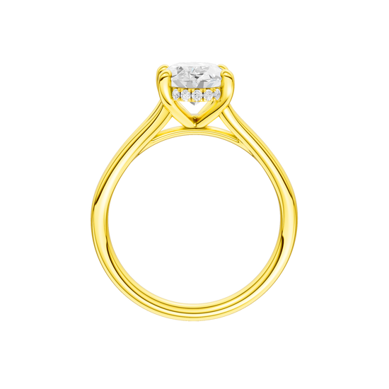 A profile view of the Oval cut diamond engagement ring in 14k yellow gold with a plain band and hidden halo setting