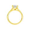 A profile view of the Oval cut diamond engagement ring in 14k yellow gold with a plain band and hidden halo setting