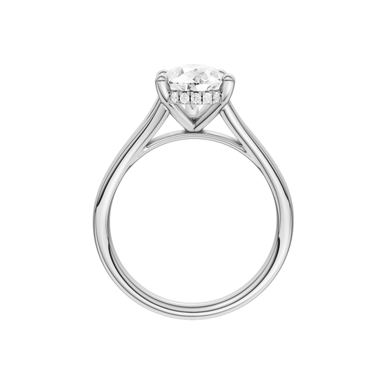 A profile view of the Pear cut diamond engagement ring in 14k white gold with a plain band and cathedral setting