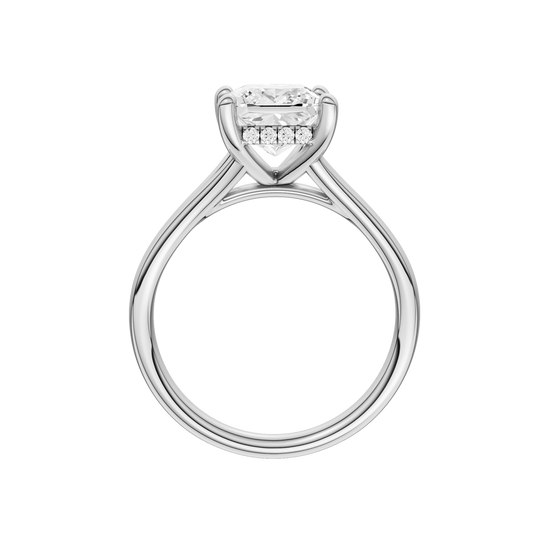 A profile view of the Princess cut diamond engagement ring in platinum with a plain band and hidden halo setting
