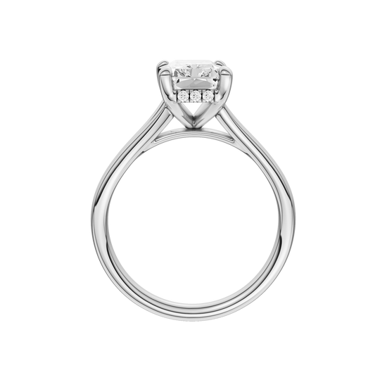 A profile view of the Radiant cut diamond engagement ring in platinum with a plain band and hidden halo setting