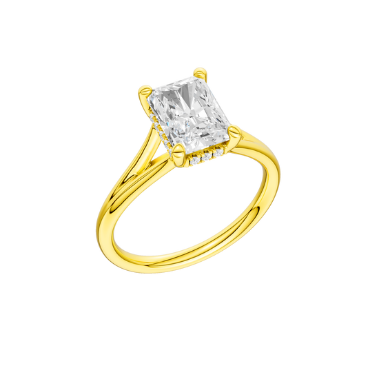 A three-quarter view of the Radiant cut diamond engagement ring in 14k yellow gold with a plain band and hidden halo setting