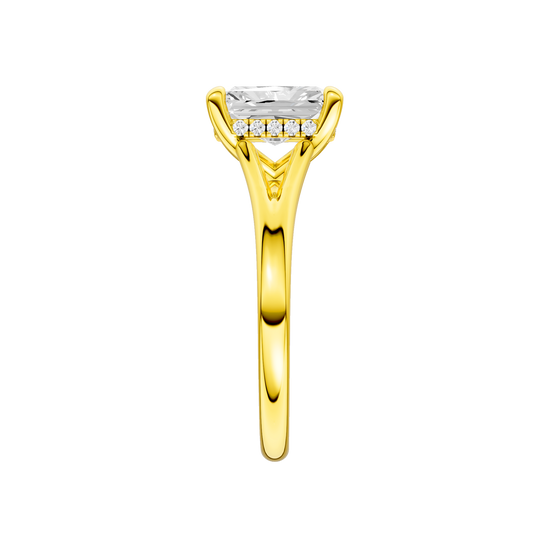 A side view of the Radiant cut diamond engagement ring in 14k yellow gold with a plain band and hidden halo setting