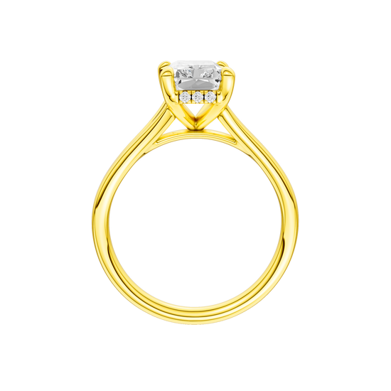 A profile view of the Radiant cut diamond engagement ring in 14k yellow gold with a plain band and hidden halo setting