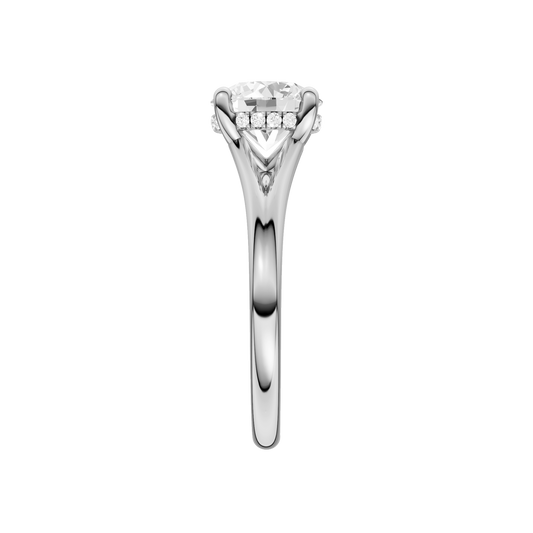 A side view of the Round cut diamond engagement ring in 14k white gold with a plain band and hidden halo setting
