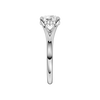 A side view of the Round cut diamond engagement ring in platinum with a plain band and hidden halo setting