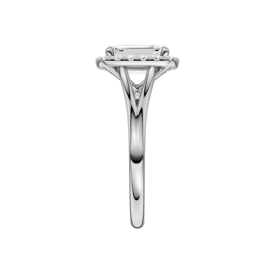 A side view of the Emerald cut diamond engagement ring in platinum with a plain band and halo setting