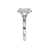 A side view of the Emerald cut diamond engagement ring in platinum with a plain band and halo setting