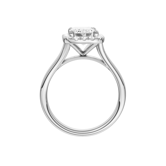 A profile view of the Emerald cut diamond engagement ring in platinum with a plain band and halo setting