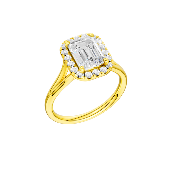 A three-quarter view of the Emerald cut diamond engagement ring in 14k yellow gold with a plain band and halo setting