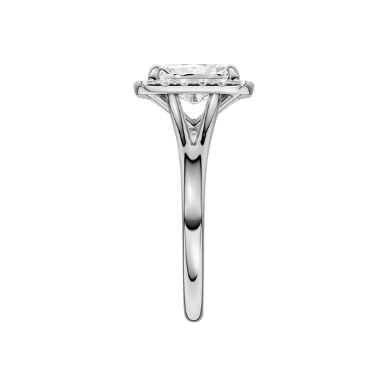 A side view of the Radiant cut diamond engagement ring in 14k white gold with a plain band and halo setting